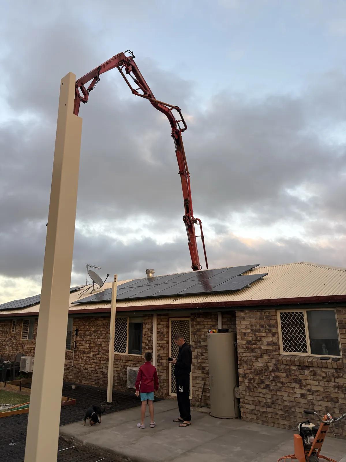 Concrete pump truck pouring a residential slab in Mackay