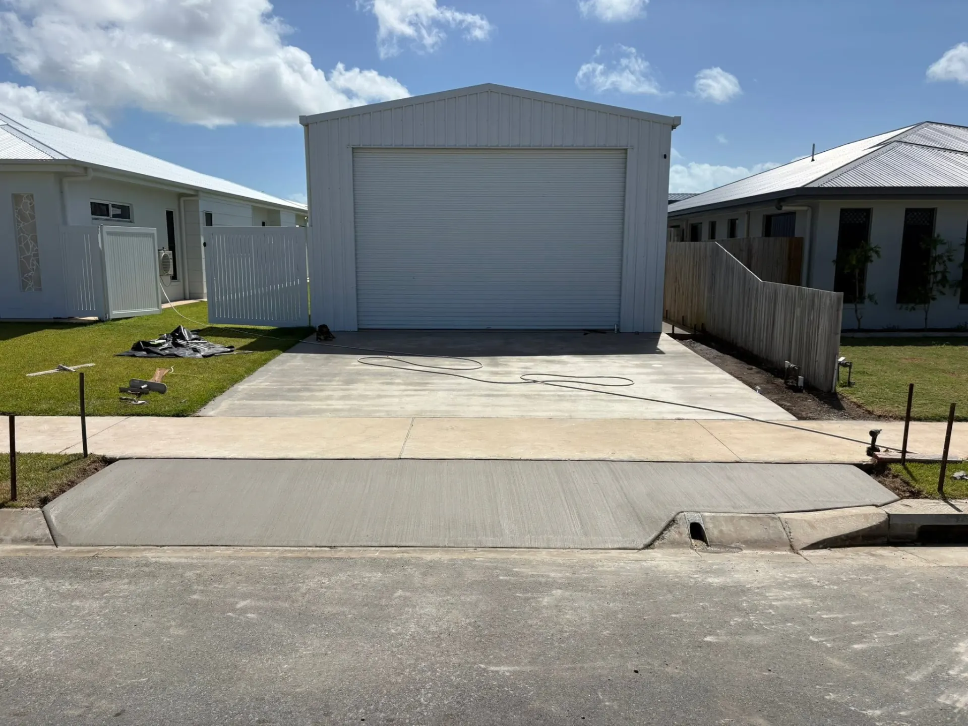 Freshly poured concrete driveway and shed slab in Mackay